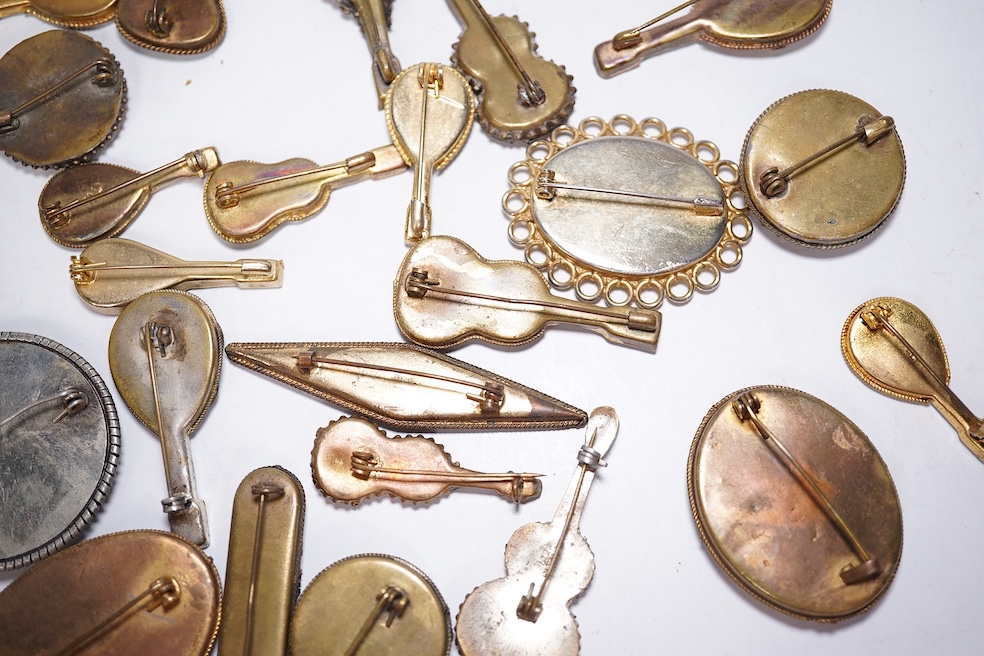 A collection of thirty-one micro-mosaic brooches, including fourteen mixed guitar and banjo shaped brooches, six large oval brooches and seven smaller brooches, three long brooches and a star shaped brooch. Condition - g